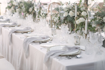 lovely Table setting for magnificent composition from flowers at a wedding , Centerpiece white and orange color palette flower bouquet arrangement
