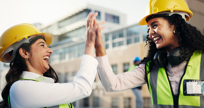 High five, women or contractor in city for architecture project, success or construction site. Excited, target or happy builders in engineering for repair goals, development or renovation progress