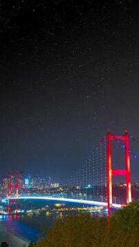 Bosphorus Bridge and cityscape oof Istanbul and starry night timelapse. Istanbul background vertical video.