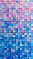 A colorful mosaic of glass squares, each with its own unique color and pattern, arranged in an abstract grid on the wall, creating a visually appealing and textured backdrop.
