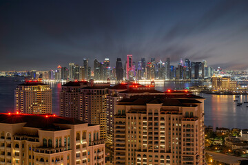 Doha, Qatar - December 20, 2024: Aerial view of Pearl Qatar Porto Arabia with Doha Skyline early...