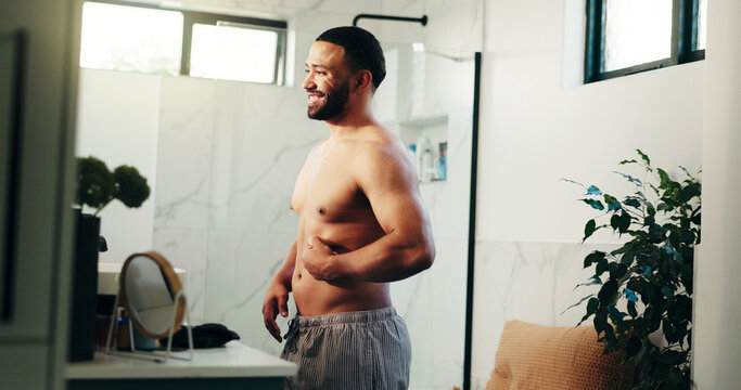 Happy man, belly and weightloss in bathroom for personal care or self confidence at home. Male person, body and topless smile with stomach fat in satisfaction for morning routine or diet at house