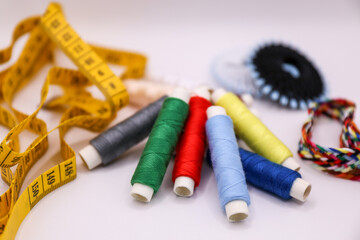 Sewing accessories and threads on a white background. Sewing kit.