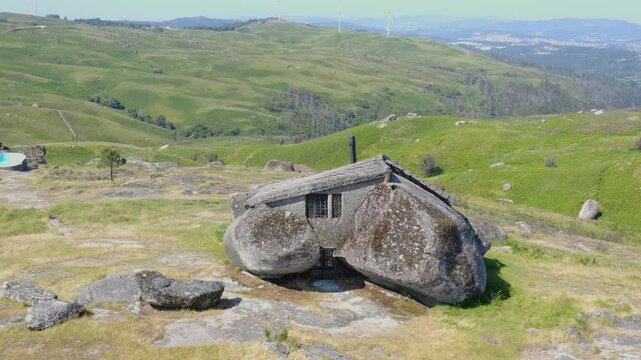The Casa do Penedo boulder house in the Portuguese mountains. Aerial view.