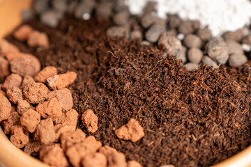 Organic potting soil mix with clay pebbles, coco coir, pumice and akadama for indoor plants,...