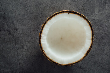 Fresh Coconut Slice on Dark Concrete Background for Culinary or Natural Lifestyle Themes