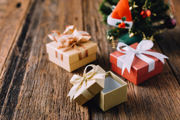 Colorful Christmas Gift Boxes with Elegant Ribbons on Wooden Table