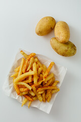 Crispy French Fries with Fresh Potatoes on White Background