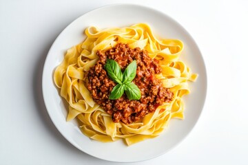 Tagliatelle pasta with Bolognese sauce, neatly swirled on a round white ceramic plate, garnished with fresh basil on top.