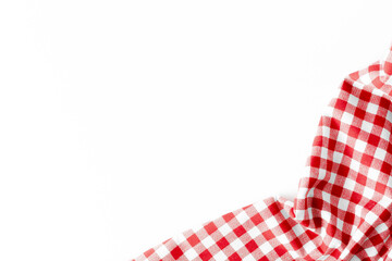 Obraz premium Checkered Red and White Tablecloth on White Background for Dining and Decor