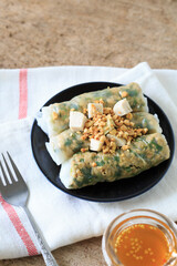 Freshly Made Rice Paper Rolls with Peanut Sauce on Wooden Background