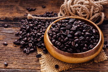 Freshly Roasted Coffee Beans in Wooden Bowl on Rustic Table