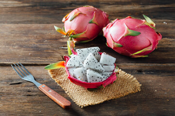 Fresh Dragon Fruit with Fork on Rustic Wooden Table Display