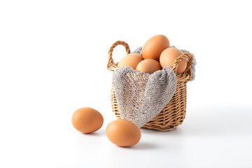 Fresh Brown Eggs in a Woven Basket with Knit Cloth Heart Accent