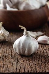 Fresh Garlic Bulb on Wooden Surface with Rustic Setting