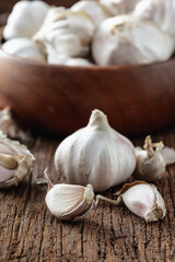 Fresh Garlic Bulbs and Cloves on Rustic Wooden Table Background