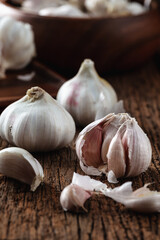 Fresh Garlic Bulbs and Cloves on Wooden Table for Culinary Use