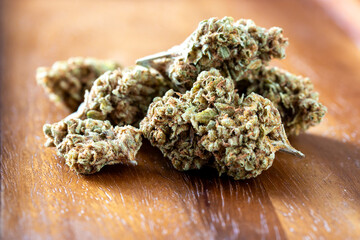 Close-Up of Fresh Cannabis Buds on Wooden Surface for Herbal Use