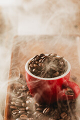Freshly Roasted Coffee Beans in Red Mug with Steam Rising