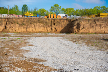 Cleared construction site prepared for building foundation. Excavation area ready for new...