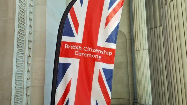 London, UK, June 18th 2025: British Citizenship ceremony Union Jack flag sign banner. Ceremonies held at the Old MaryleboneTown Hall, Westminster Council house, 97-113 Marylebone Road. Static shot 4K.