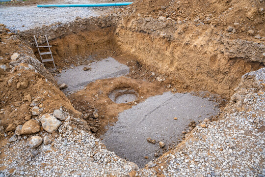Plate load test results visible on soil surface after static pressure application. Ground investigation for foundation suitability and load-bearing capacity