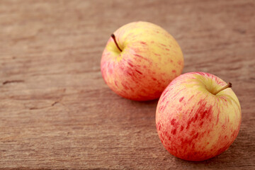 Fresh Red and Yellow Apples on Rustic Wooden Table Surface