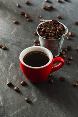 Fresh Brewed Coffee with Beans in Bucket on Dark Stone Surface