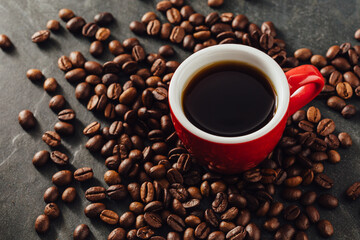 Freshly Brewed Coffee in Red Cup Surrounded by Coffee Beans