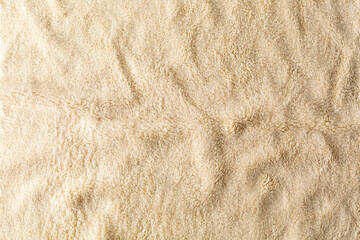 Soft and Cozy Tan Fabric Texture for Background or Textile Use