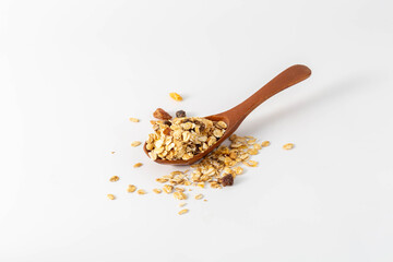 Wooden Spoon with Oats and Dried Fruits on White Background