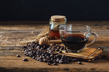 Aromatic Coffee with Honey and Roasted Beans on Rustic Wooden Table