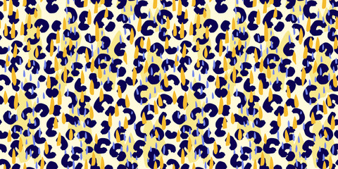 Summer seamless vector pattern with abstract leopard spots and colorful raindrop shapes in navy, blue and yellow. Bold and playful design for fashion and modern textile prints