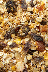 Close-up of Tasty Granola with Nuts and Dried Fruits on Surface