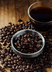 Aromatic Coffee Beans and Fresh Brewed Coffee on Wooden Table