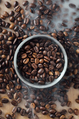 Fresh Roasted Coffee Beans in a Silver Bowl on Wooden Background