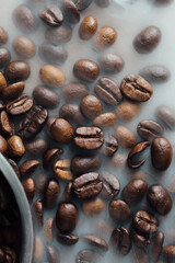 Coffee Beans on a Light Background with Steam Rising Above Them
