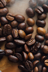 Assorted Coffee Beans in Various Shades on Wooden Surface