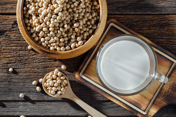 Fresh Soybeans and Soy Milk on Rustic Wooden Table Background