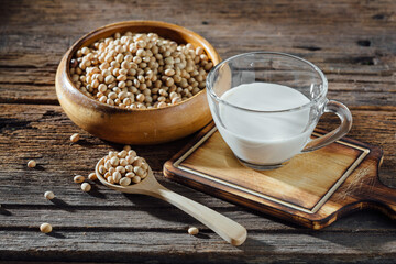 Freshly Made Soy Milk in Clear Glass Cup with Soybeans in Bowl