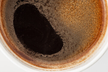 Close-Up View of Dark Brewed Coffee with Crusty Surface Texture