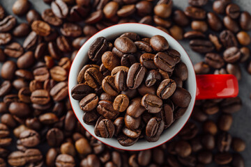 Close-Up of Freshly Roasted Coffee Beans in Red Cup on Table