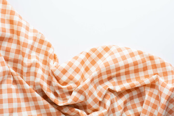 Orange and White Checkered Fabric on a Light Background