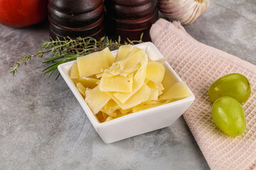 Parmesan cheese slices in the bowl