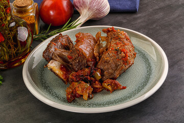 Baked beef ribs with vegetables