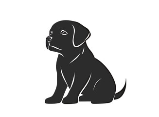 Fototapeta premium Black Labrador puppy sitting, looking curiously with a gentle expression.