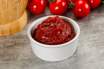 Red tomato paste in the bowl