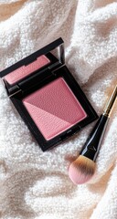 Blush compact and brush on a soft towel