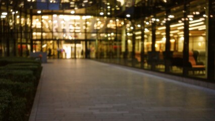 Blurred cityscape with bokeh lights illuminates a london street at night during winter, showcasing...