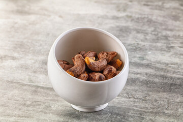 Unpeeled cashew nuts in the bowl